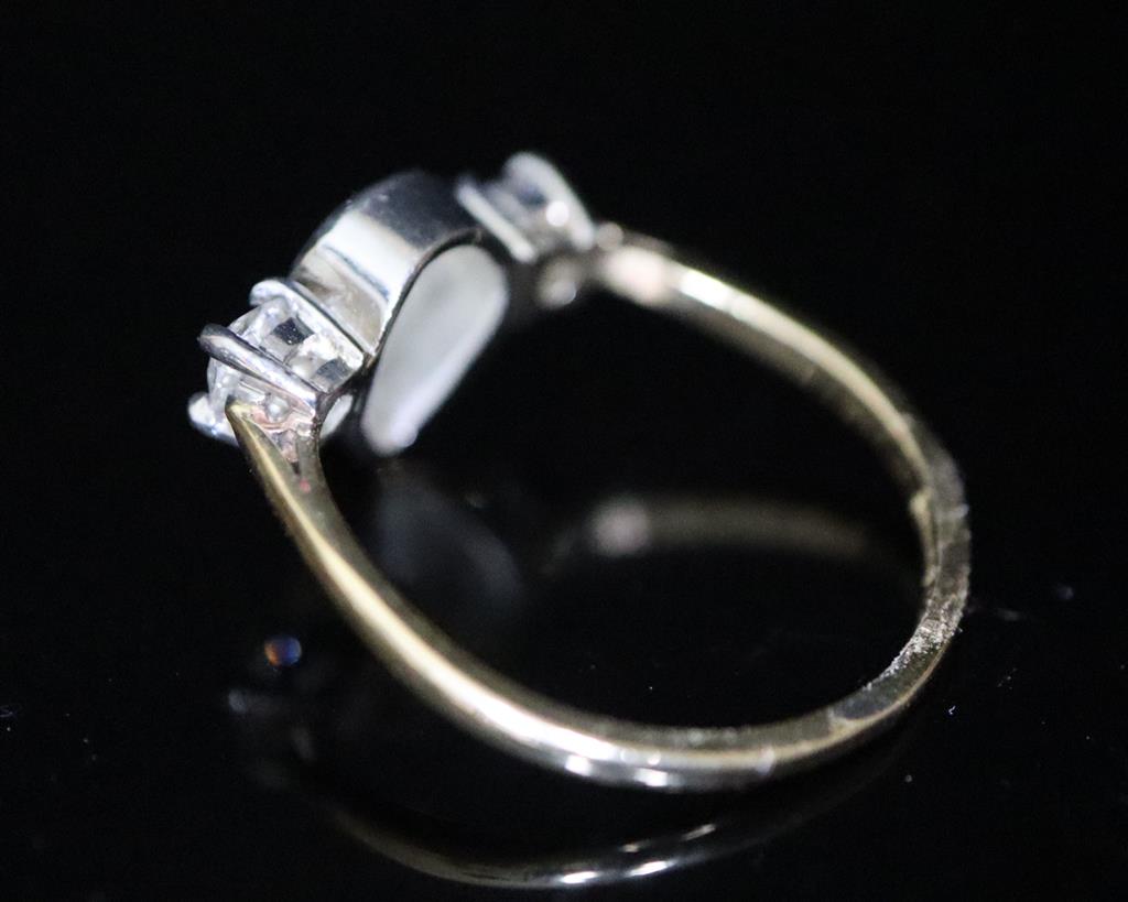 A gold and three stone diamond ring,